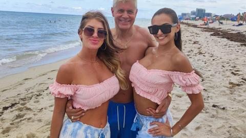 Busty brunettes Lolly and Armani enjoy a steamy bedroom threesome