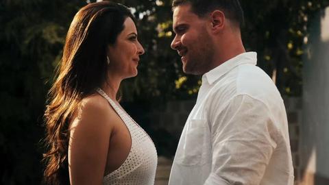 Hot mature brunette with big tits plays outdoors